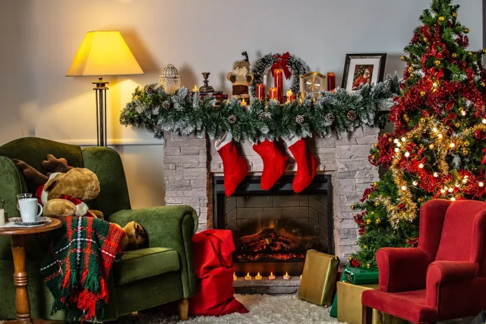 green sofa chair beside green christmas tree