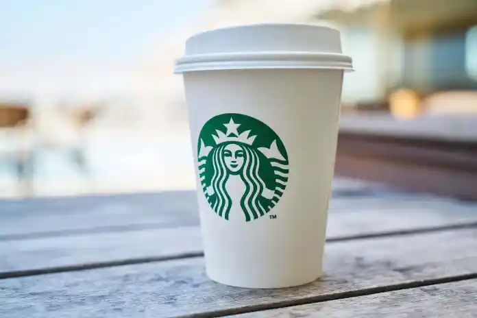 closed white and green starbucks disposable cup